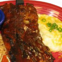 Baby Back Ribs · Our full rack of famous falling-off-the-bone, slow-cooked baby back ribs smothered in our sw...