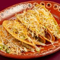 #4 Ground Beef Tacos (2) · Ground beef tacos topped with lettuce and cheese.
served with rice and beans.