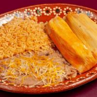 #8 Tamales (2) · Red pork tamales. Served with rice and beans.