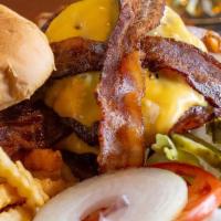 Lunch Bacon Cheeseburger · Burger with cheese and crispy bacon strips. Served with side fries.