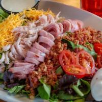 Lunch Chef'S Salad · Bed of lettuce topped with shredded cheese, ham, bacon, cucumbers, tomatoes, egg and homemad...
