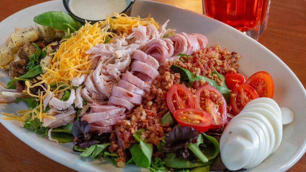 Lunch Chef'S Salad · Bed of lettuce topped with shredded cheese, ham, bacon, cucumbers, tomatoes, egg and homemade croutons. Served with your choice of dressing on the side.