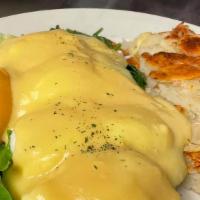 Eggs Florentine · 2 toasted English muffin halves, each topped with spinach and a poached egg, then ladled wit...