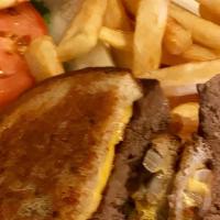 Patty Melt Burger · Juicy burger topped with grilled onions and melted American cheese on grilled rye bread with...