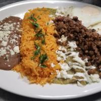 Steak Chilaquiles · Traditional chilaquiles with green or red salsa, topped with sour cream, onions and cheese. ...