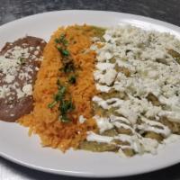 Chilaquiles · Traditional chilaquiles with green or red salsa, topped with sour cream, onion and cheese. S...