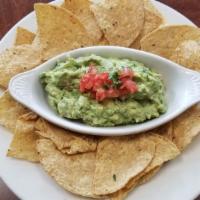 Guacamole W  Chips · Fresh hass avocado with onion, tomato, cilantro, jalapeño pepper and fresh lime. Served with...