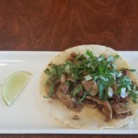 Taco Tripa  · Home made beef tripe ,onion cilantro