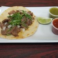 Taco Lengua · seasoned homemade beef tongue, onions cilantro .