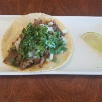 Taco Barbacoa · beef barbacoa. onion cilantro