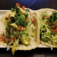 Veggie Taco · onion ,Red and green bell pepper, zucchini cooked, topped with lettuce, pico de gallo  avoca...