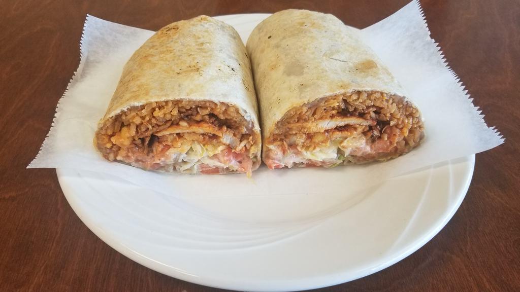 Burrito · Filled with rice, beans, cheese, lettuce, tomato, sour cream and choice of meat.