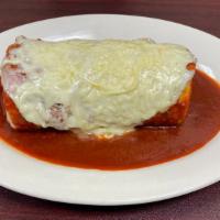 Burrito Suizo  · filled with steak, beans, rice, , cheese and sour cream, topped with red salsa and a layer o...