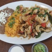 Chicken Fajitas Plate · chicken breast . Sautéed green and red bell peppers and onion.  letucce pico de gallo  guaca...