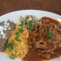 Lomo Chile Arbol Platle · Tender pieces of  steak sautéed with delicious spicy chile de árbol salsa. Served with Mexic...