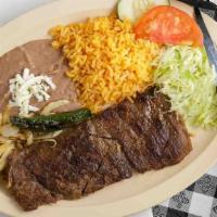 Carne Asada (Grilled Steak) · Comes with rice, beans, sour cream and corn or flour tortilla.