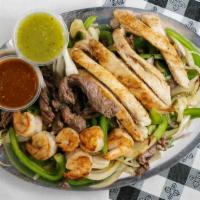 Fajita Mix · Steak, chicken and shrimp with onion and green pepper.