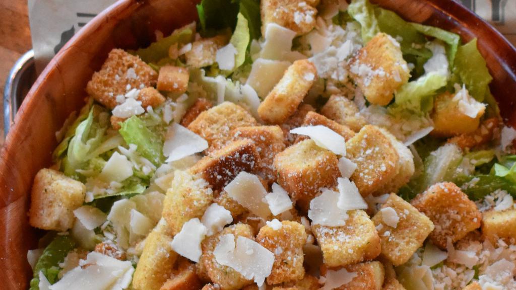 Caesar (Lg) · Romaine lettuce, shaved parmesan, croutons, and our Caesar dressing.