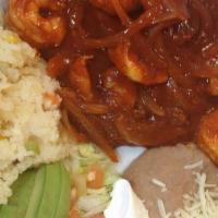 Camarones A La Diabla · Shrimp cooked with a very hot chile de arbol salsa, served with refried beans, Mexican rice,...