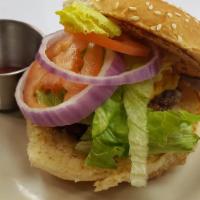 Tex-Mex Burger · Half pound, grilled burger topped with bacon, avocado, sautéed onions, tomato, lettuce, and ...