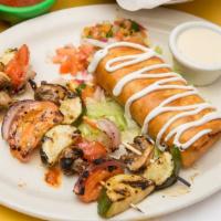Chimichanga · Choice of ground beef, shredded chicken, or carnitas with shredded cheese fried in a flour t...