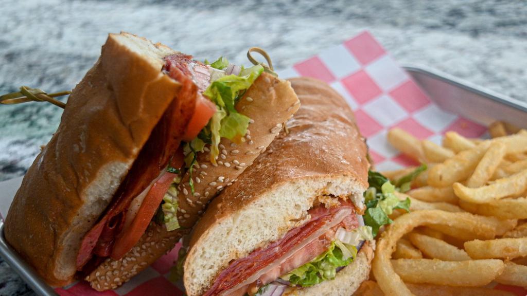 Big Papi Italian Grinder · Pepperoni & Genoa Salami, Capicola, Melted Provolone, Lettuce, Tomato, Red Onion, Mayo, Italian Dressing, Garlic Butter Spread & Served on a Toasted Hoagie Roll