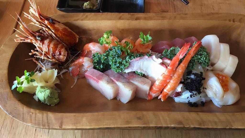 Sashimi Platter · Chef's selection of 8 pieces of sashimi and your choice of any basic maki.
