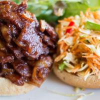 Barbeque Seitan Sandwich · Served open face on a toasted bun with Carolina slaw (v)