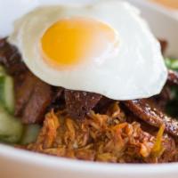 Bibim Bop Rice Bowl · Spicy grilled seitan and marinated vegetables on a bowl of brown and jasmine rice topped wit...