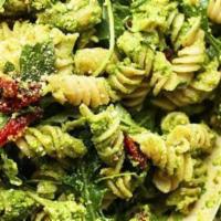 Pesto Pasta Primavera · Cashew-basil pesto, sweet red peppers, peapods, julienned carrot and aged parmesan tossed wi...