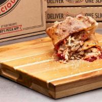 Meatball Calzone · Loaded with Wisconsin cheese, meatballs and pizza sauce.  Finished with garlic butter and a ...