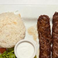 Adana Kebab Plate
 · Two skews of minced meat kebab served with grilled pepper, rice and salad.