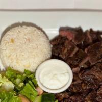 Beef Rib-Eye Steak Plate
 · Two pieces of tender grilled rib-eye steak, salad and rice.