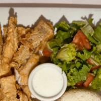 Fried Tilapia Plate
 · Two pieces deliciously seasoned tilapia fish served with rice and salad.