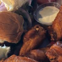 Joe'S Classic Turf And Bird · Six of our jumbo wings paired with three juicy mini burgers or mini chicken slammers and fre...