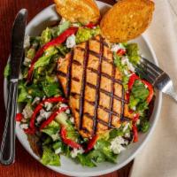 Grilled Salmon Salad · Grilled Norwegian salmon served over a bed of mixed greens, arugula, roasted red pepper and ...