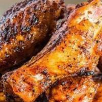 Smoked Wings · John's famous smoked wings are the stuff of legend, seasoned then smoked to perfection.