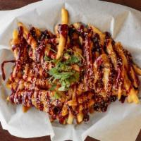 Pb&J Fries · Big boat of fresh golden crispy fries topped thai peanut sauce and raspberry chipotle jelly.