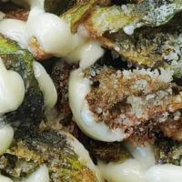 Flash Fried Brussels · Fresh and flash fried brussels sprouts with parmesan cheese and roasted garlic aioli. Add ch...