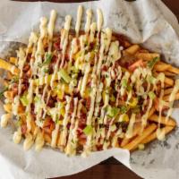 Dirty Fries · Big boat of fresh golden crispy fries topped with tomatoes, banana peppers, chopped bacon, g...