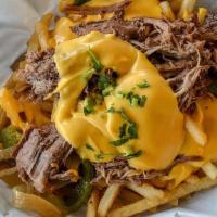 Philly Cheese Steak Fries · Big boat of fresh golden crispy fries topped with cheddar cheese sauce, slow roast beef, sau...