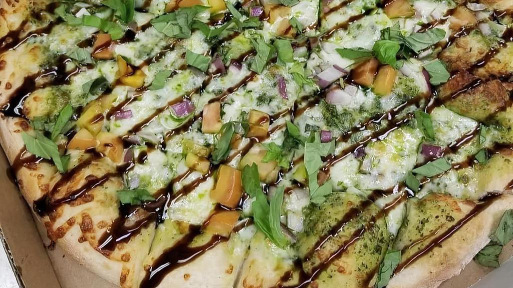 Medium The Margherita Pizza · Basil pesto sauce with mozzarella cheese, tomatoes, red onions and fresh basil drizzled with balsamic reduction.