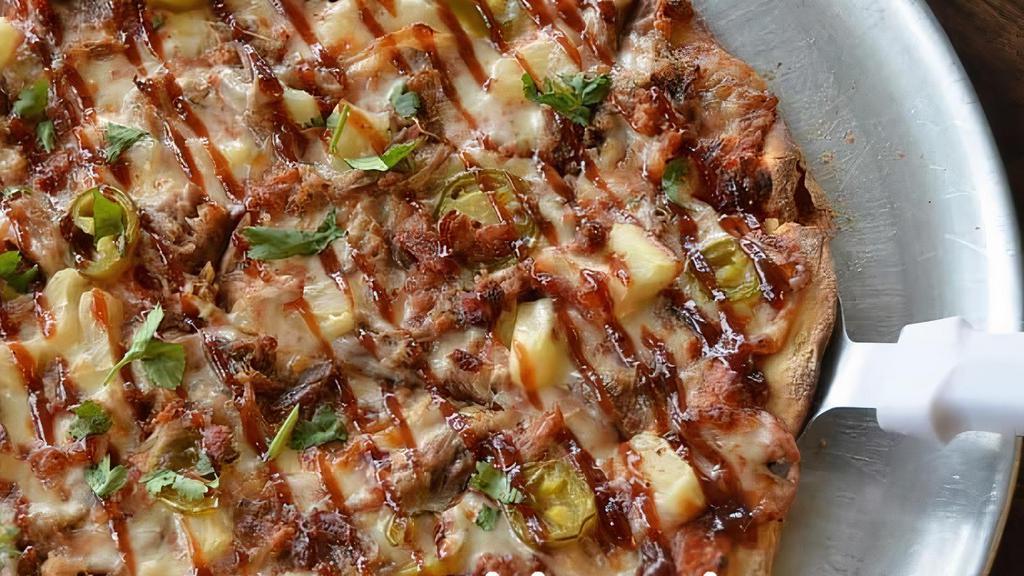 Medium The Hawlowan Pizza · Red sauce with mozzarella, pineapple pulled pork with bacon, jalapenos, cilantro with BBQ drizzle.