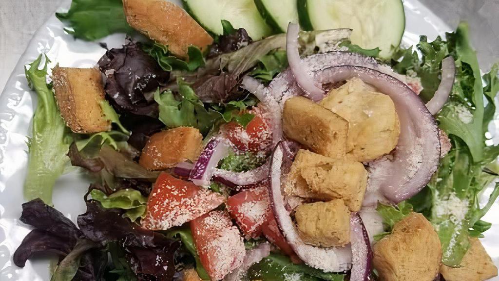 Side Salad · Organic greens with cucumbers, tomatoes, red onion, parmesan cheese with croutons and your choice of dressing. MUST INDICATE DRESSING IN NOTES: Ranch, Italian, Greek or Cilantro Lime. No indication means Ranch will be selected.
