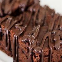 Homemade Brownies · Delicious BIG chocolate brownies drizzled w/ Ghirardelli chocolate sauce