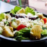 Santorini Spring · A zesty blend of tomatoes, cucumbers, artichokes and feta cheese, topped with kalamata olive...