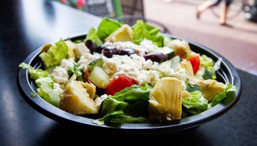 Santorini Spring · A zesty blend of tomatoes, cucumbers, artichokes and feta cheese, topped with kalamata olives and a feta dressing served on romaine.
