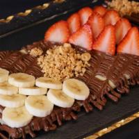 Nutella Crepes · Crepe stuffed with Nutella chocolate topped with Nutella chocolate, banana, strawberries and...