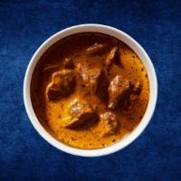 Butter Lamb Punjabi · Coal oven grilled boneless lamb chunks simmered in a smooth creamy tomato curry, garnished w...
