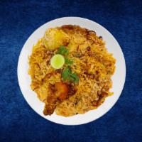 Chicken Deluxe Biryani · Tender chicken morsels cooked in a special biryani masala curry, layered with imported long ...